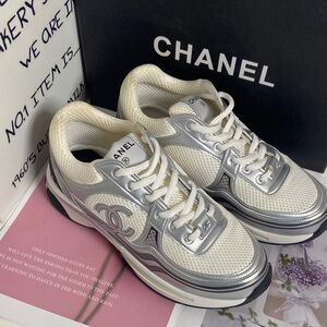 CHANEL Women's Sneakers in White and Silver